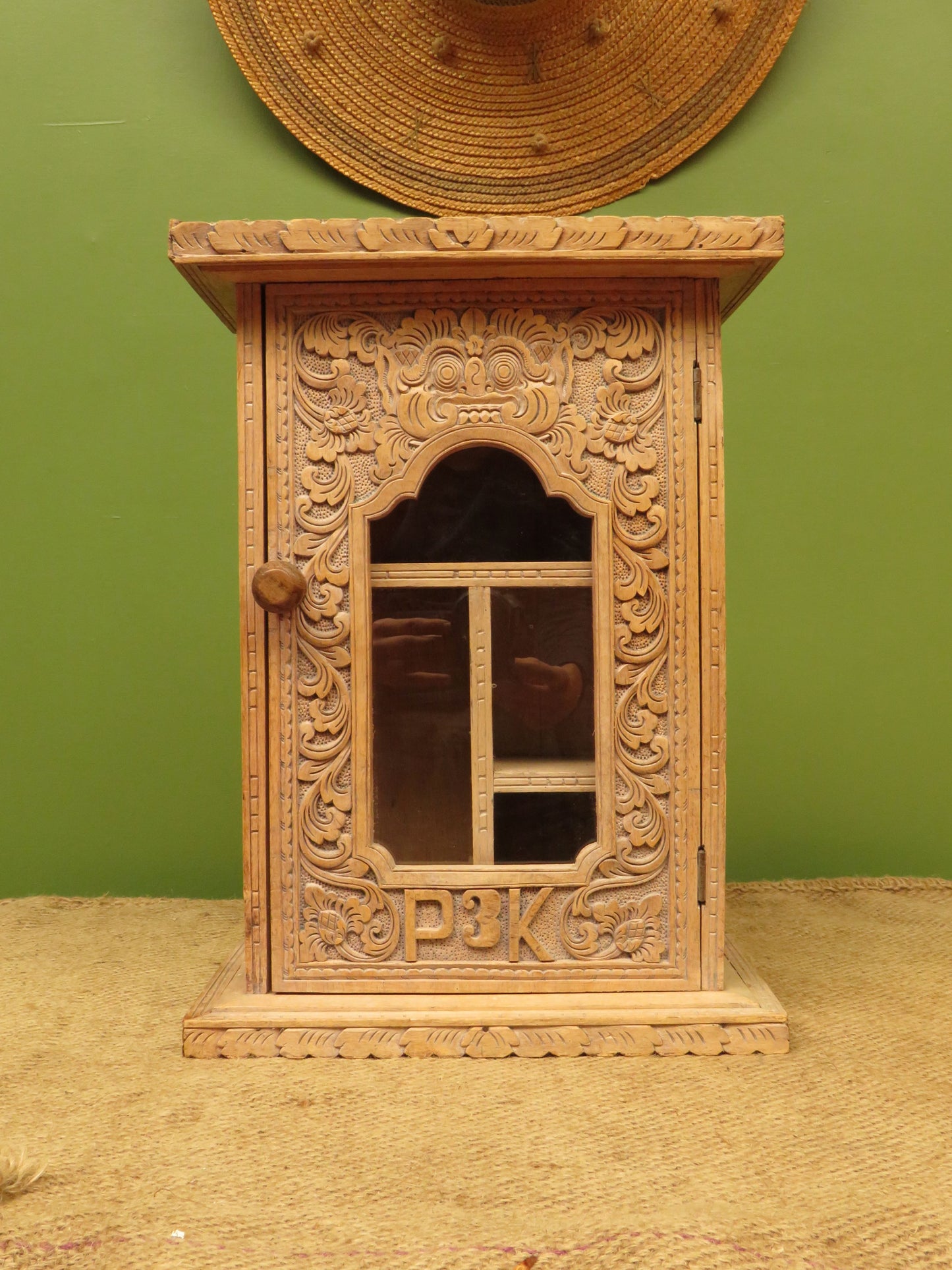 Ornate Small Indonesian Cabinet with glazed door