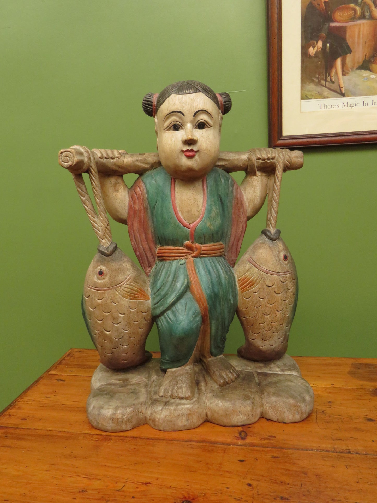 Vintage Asian wooden figure carrying fish