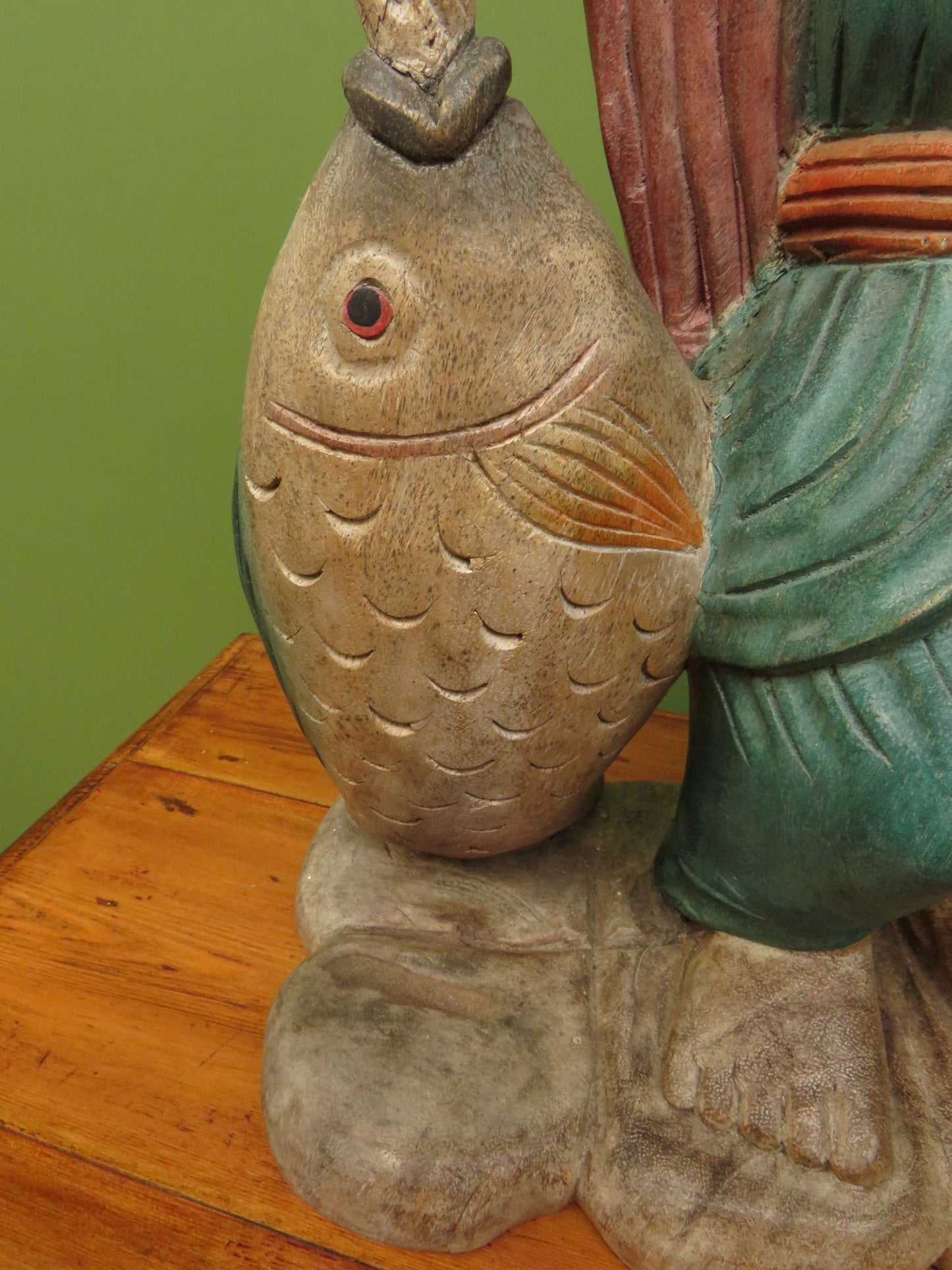 Vintage Asian wooden figure carrying fish