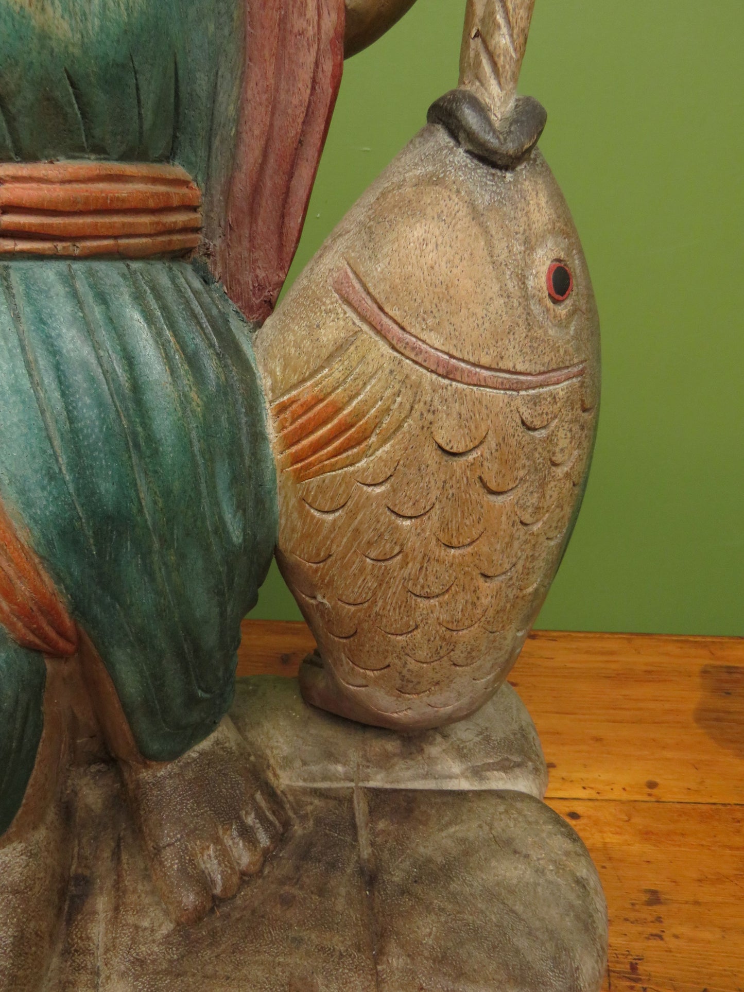 Vintage Asian wooden figure carrying fish