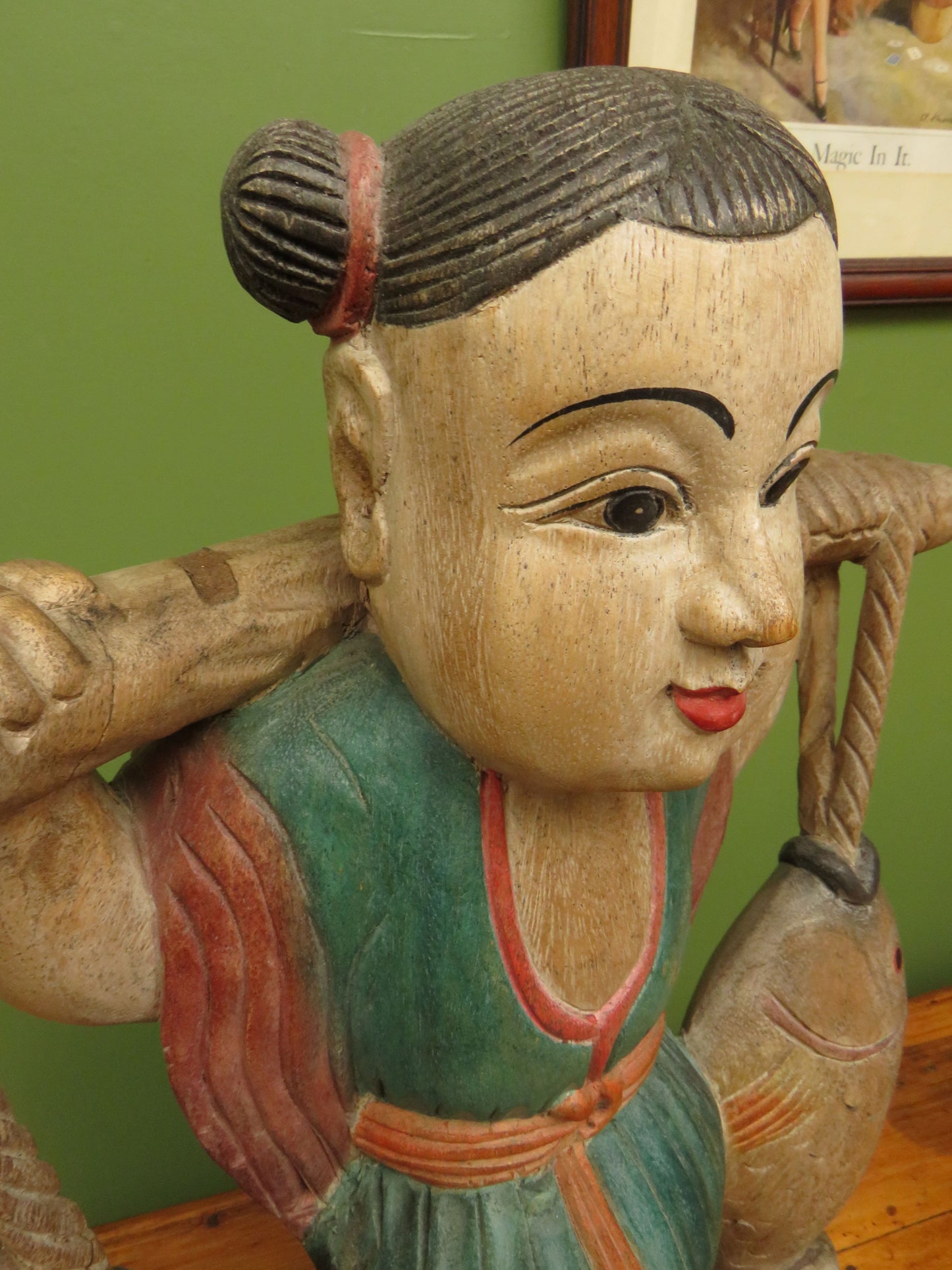 Vintage Asian wooden figure carrying fish