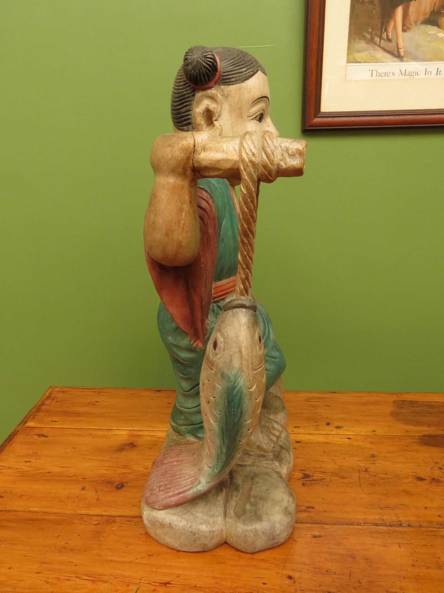 Vintage Asian wooden figure carrying fish