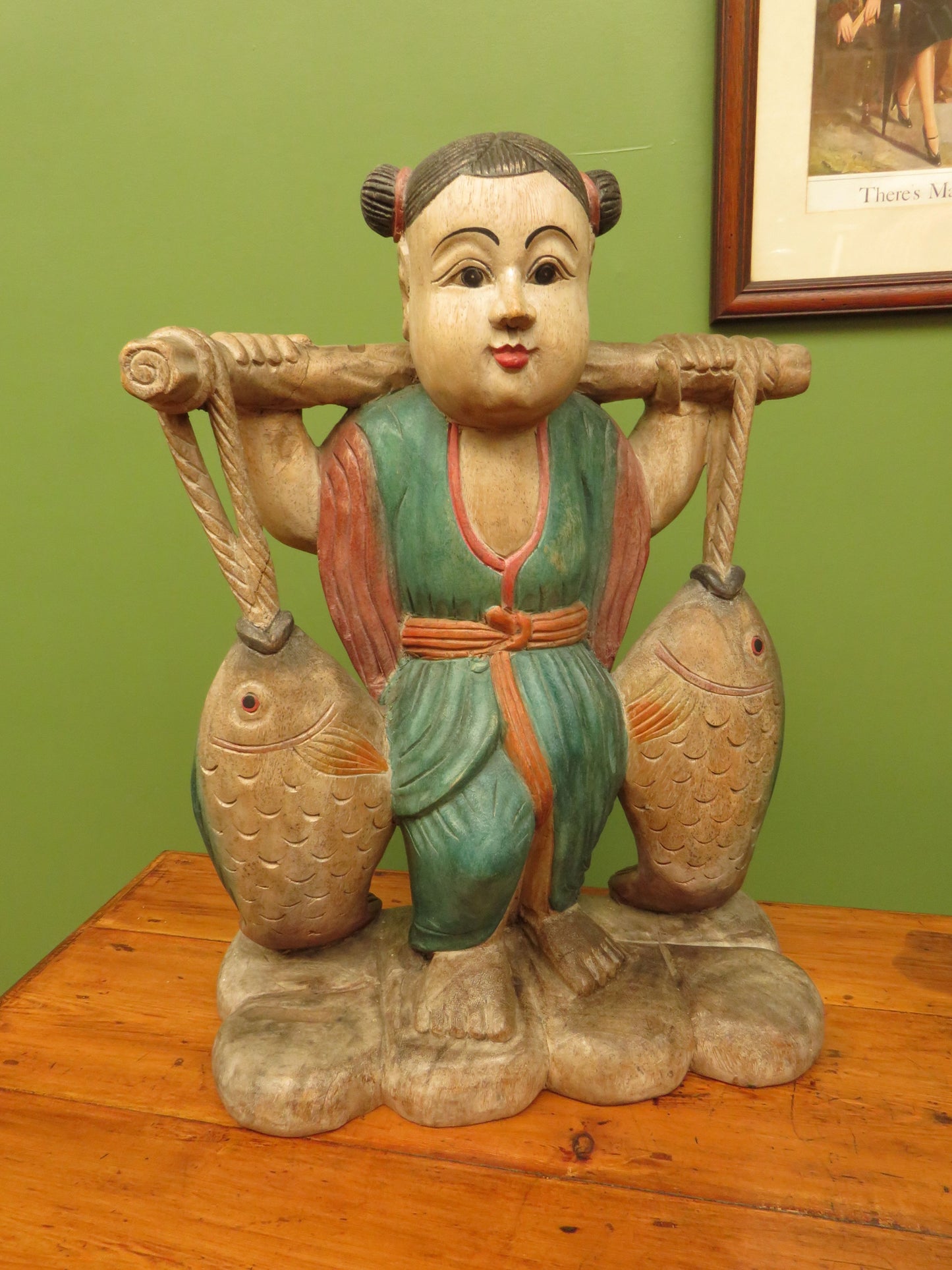 Vintage Asian wooden figure carrying fish