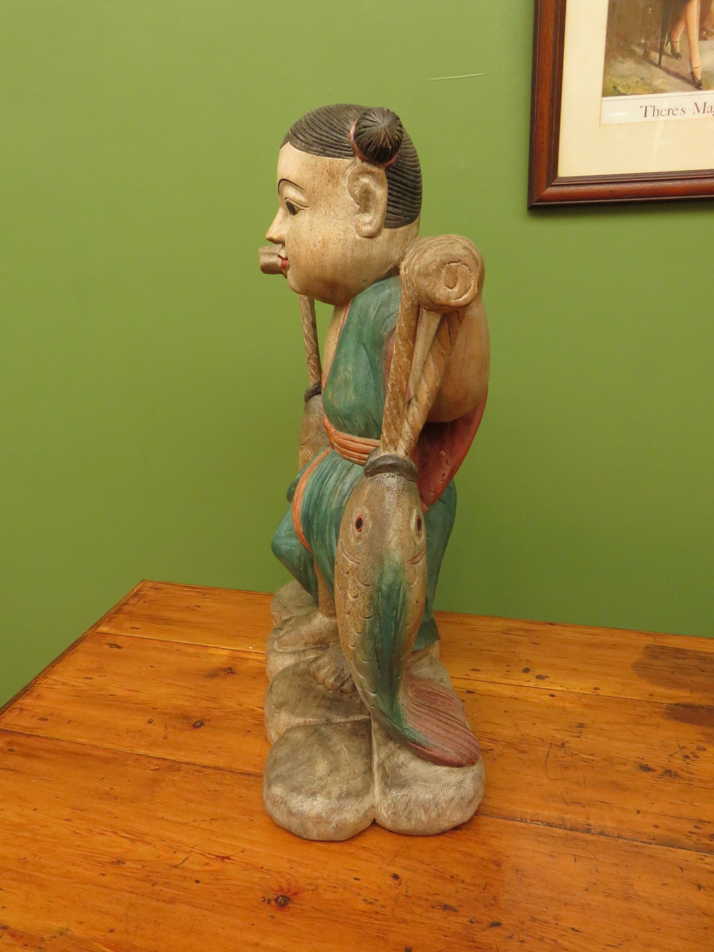Vintage Asian wooden figure carrying fish