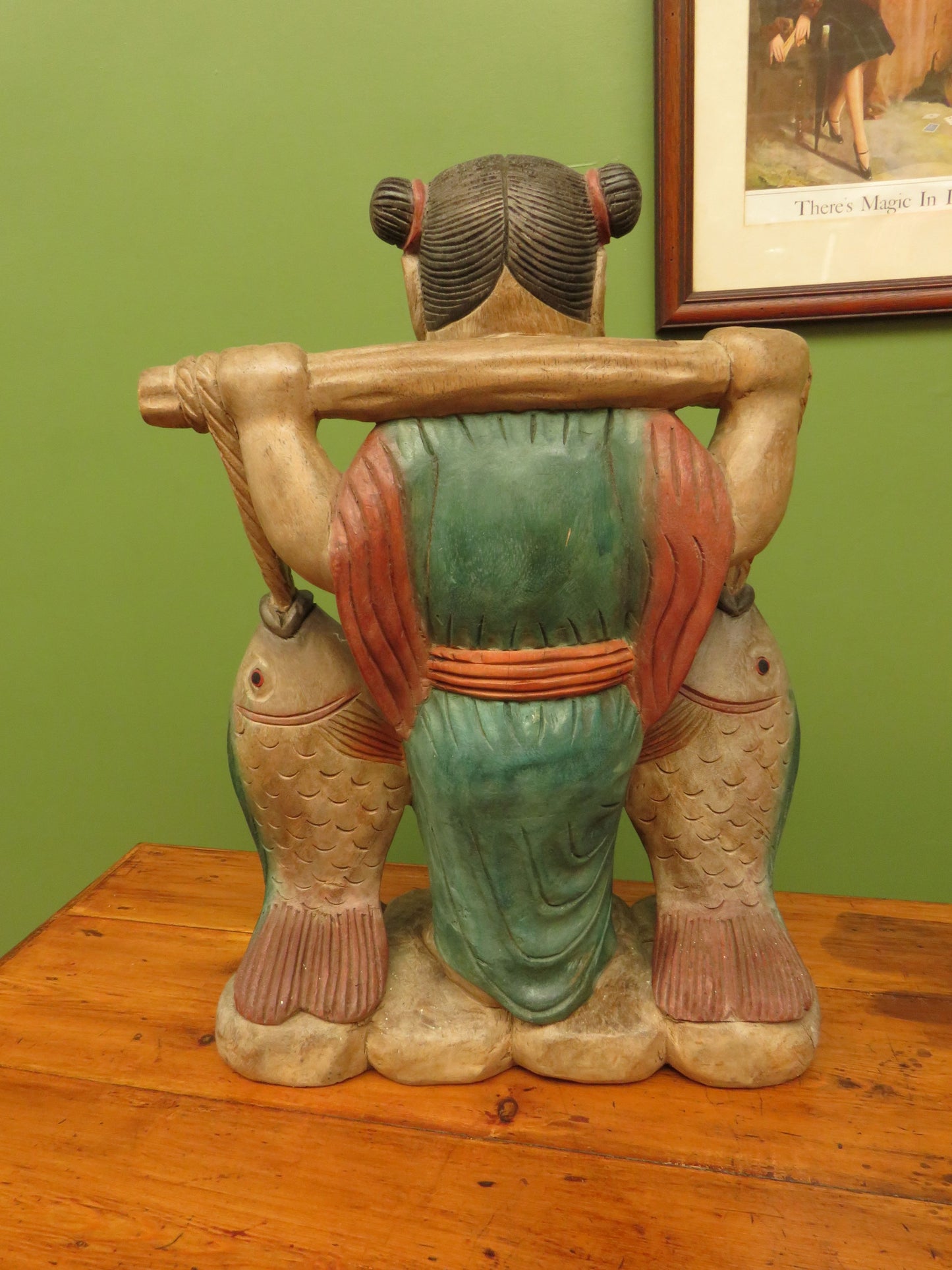 Vintage Asian wooden figure carrying fish