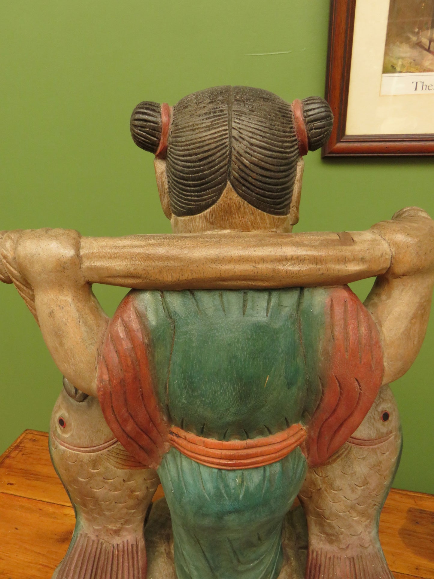 Vintage Asian wooden figure carrying fish