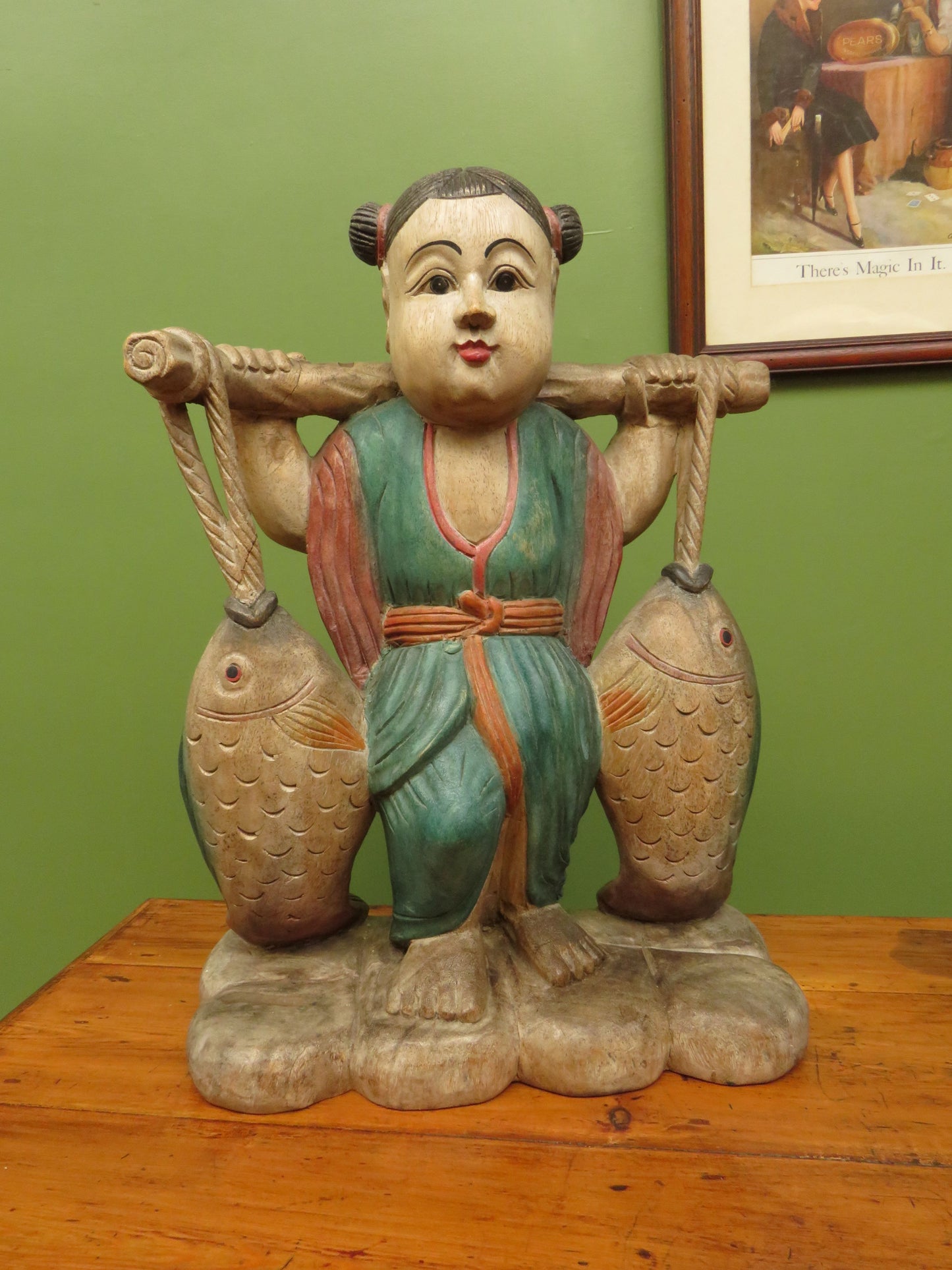 Vintage Asian wooden figure carrying fish