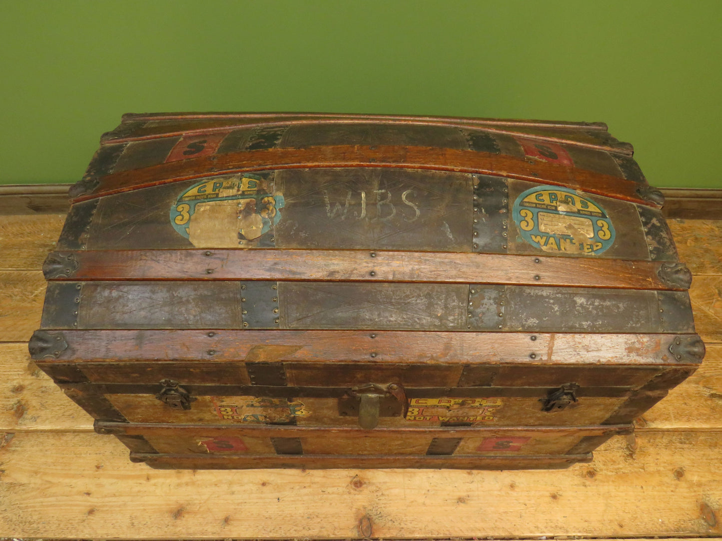 Large Antique Dome Top Travelling trunk with old Canadian luggage labels
