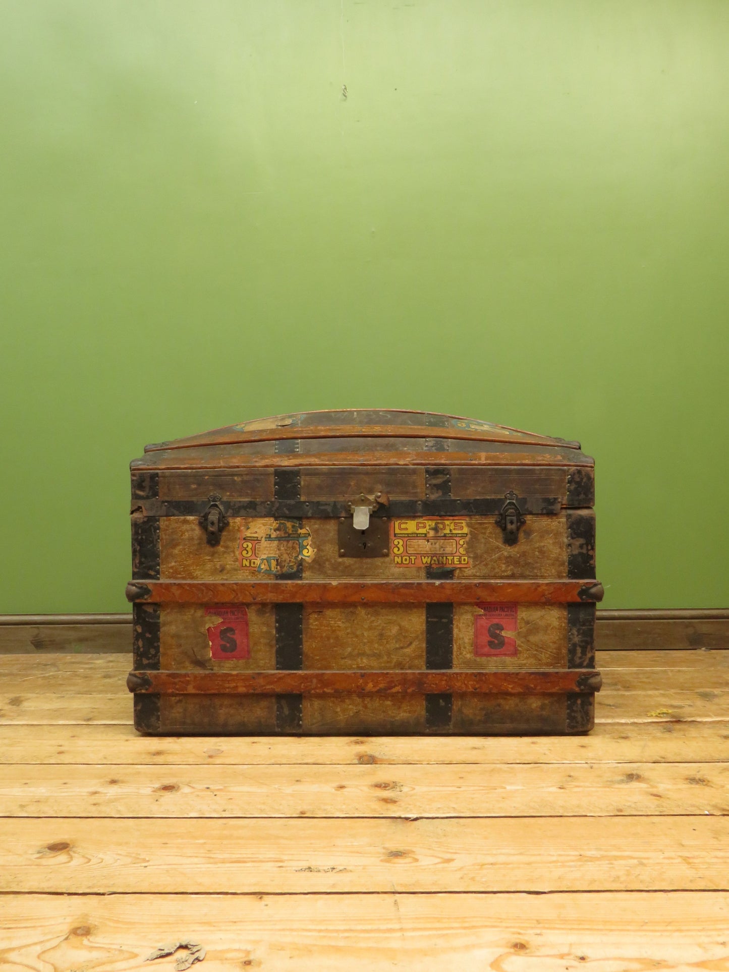 Large Antique Dome Top Travelling trunk with old Canadian luggage labels