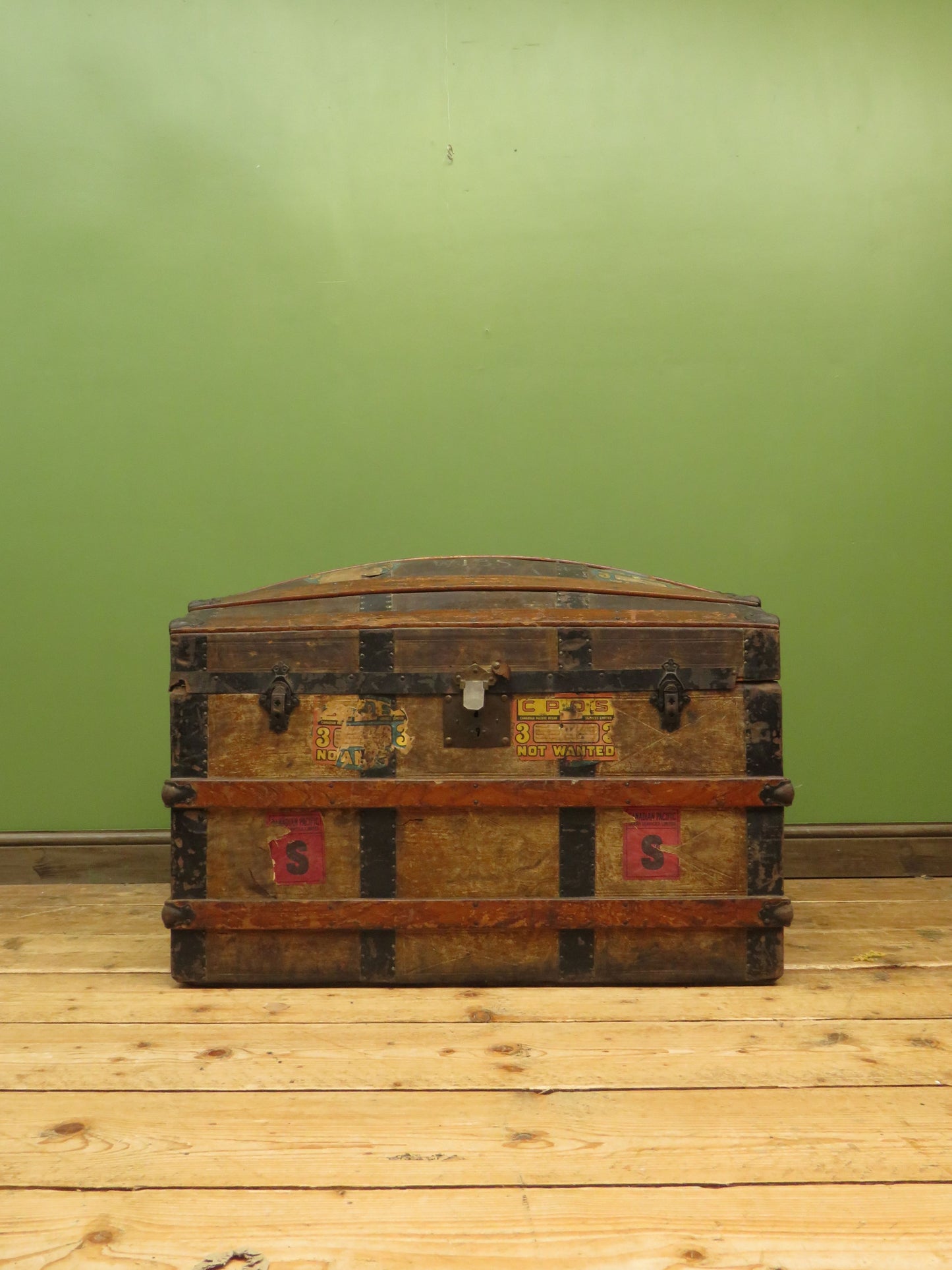 Large Antique Dome Top Travelling trunk with old Canadian luggage labels