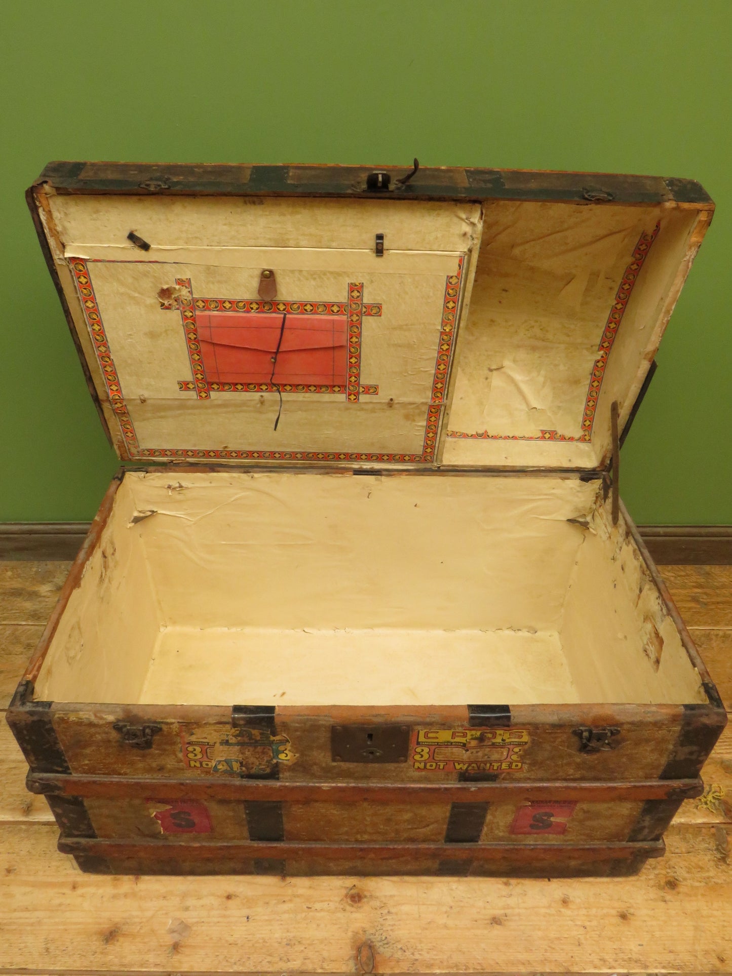 Large Antique Dome Top Travelling trunk with old Canadian luggage labels