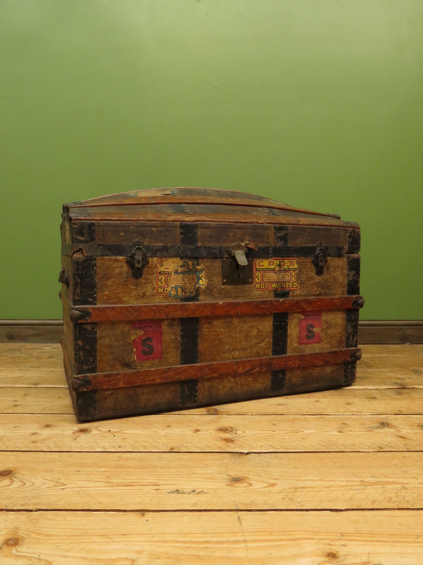 Large Antique Dome Top Travelling trunk with old Canadian luggage labels