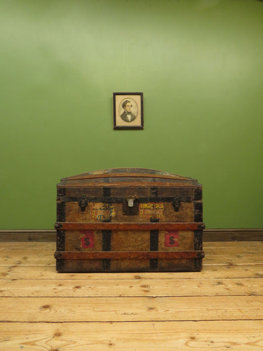 Large Antique Dome Top Travelling trunk with old Canadian luggage labels