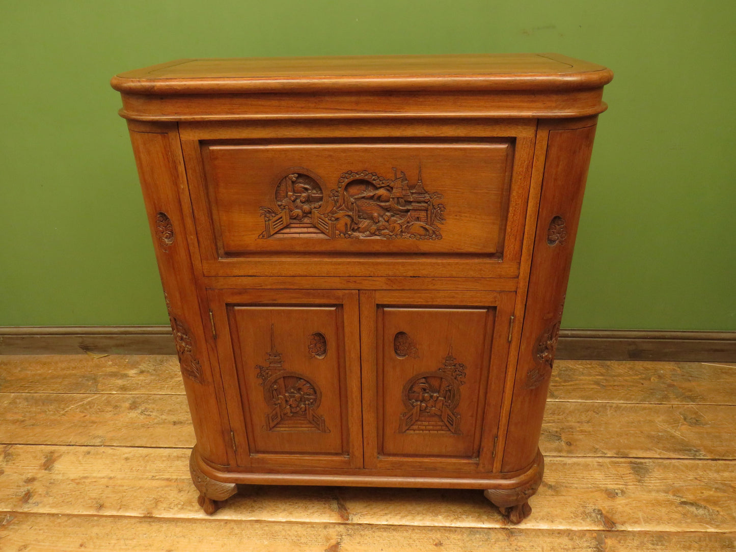 Oriental Hardwood Cocktail Cabinet with Bow Front & Carvings