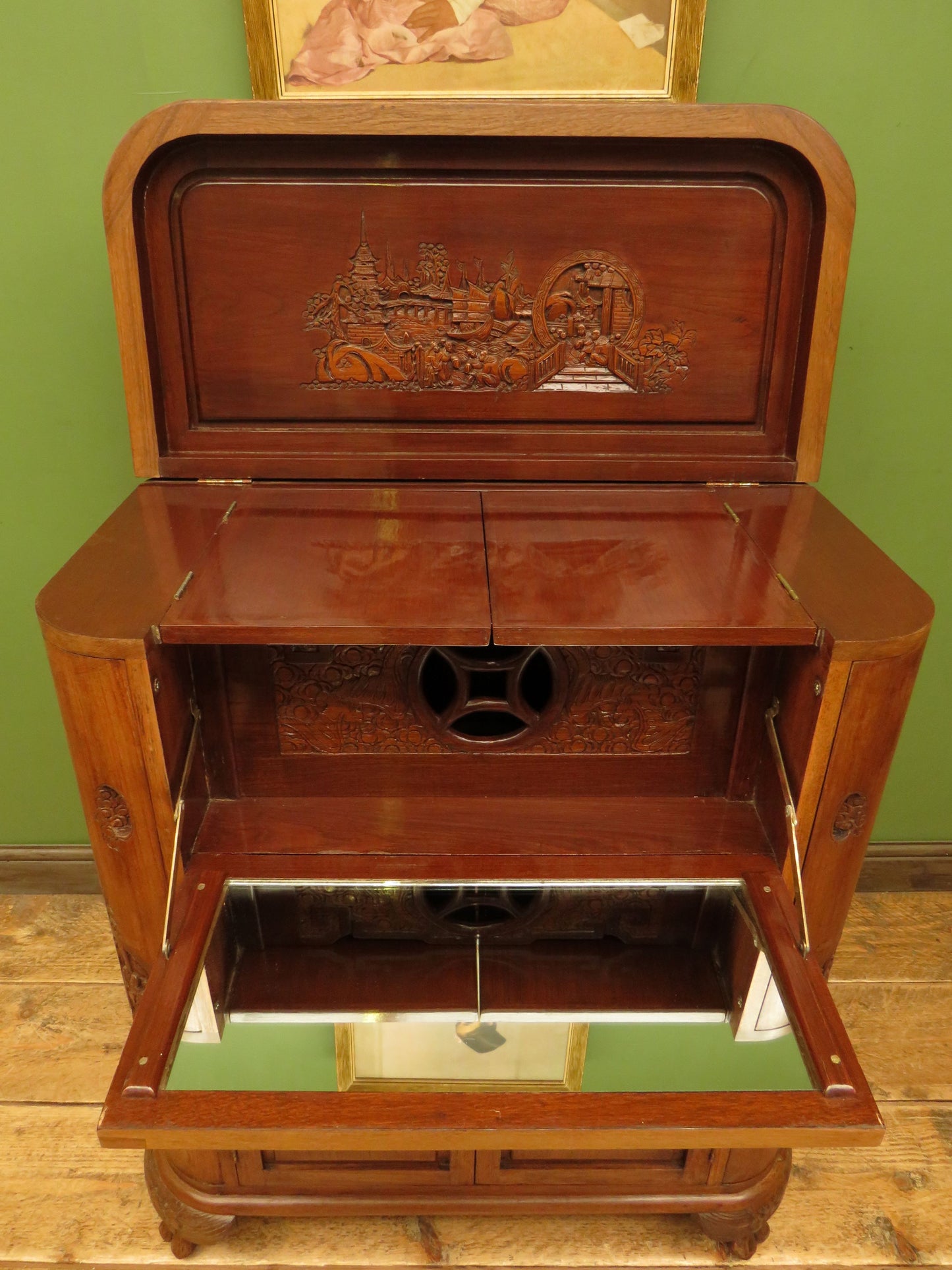 Oriental Hardwood Cocktail Cabinet with Bow Front & Carvings