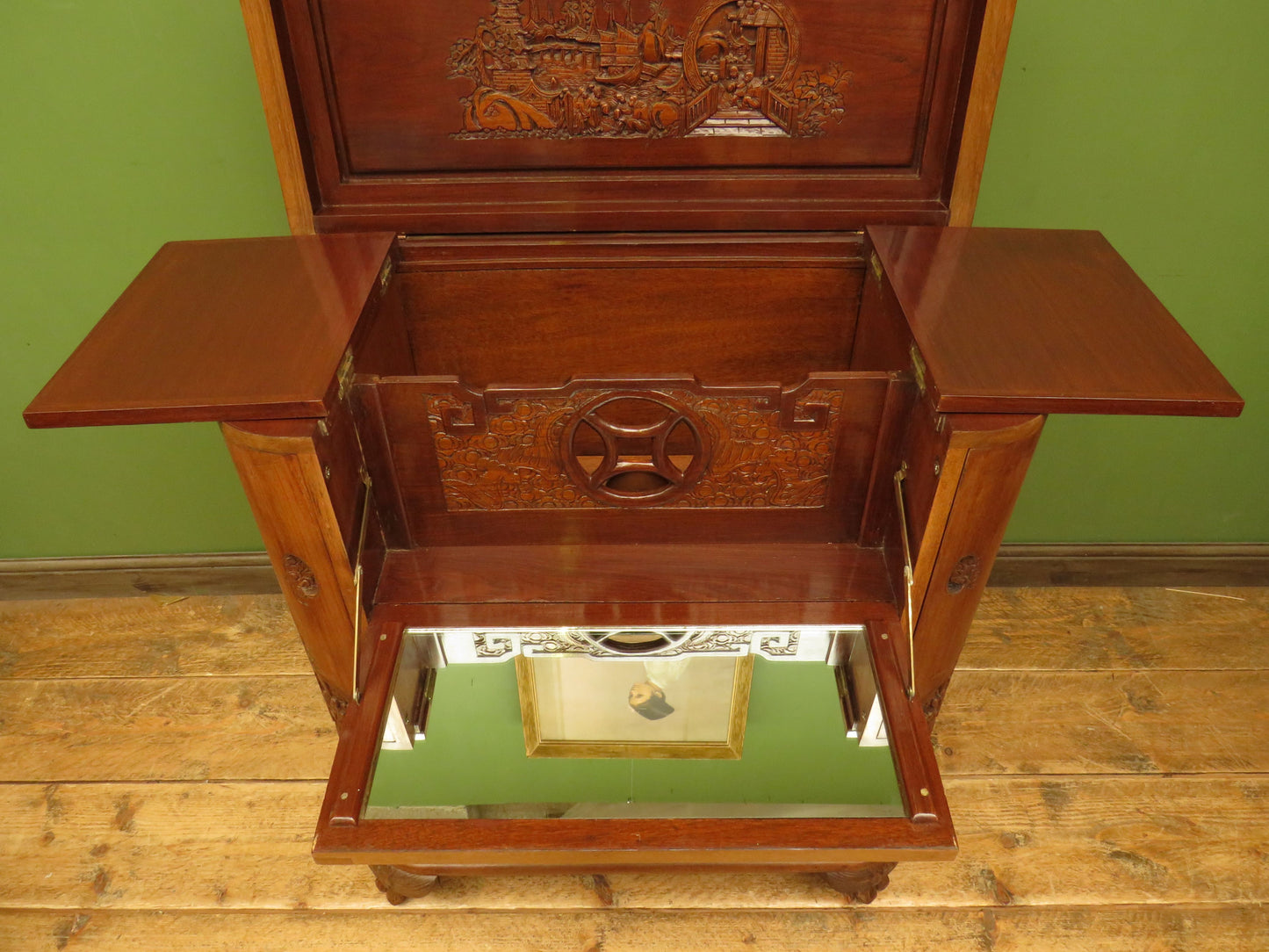 Oriental Hardwood Cocktail Cabinet with Bow Front & Carvings