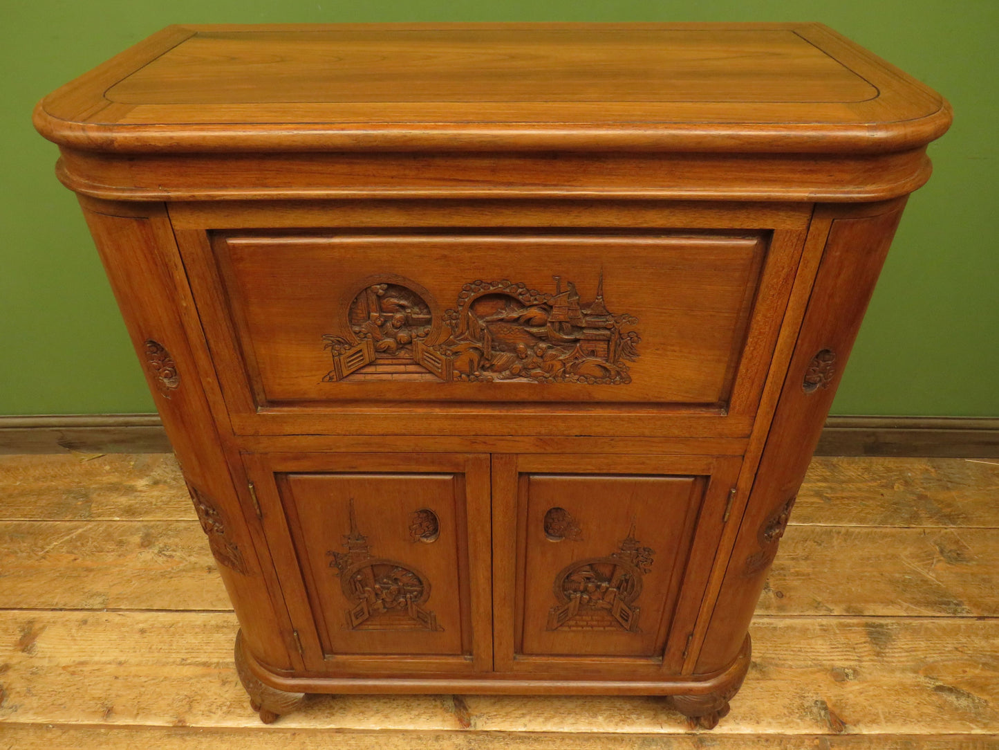 Oriental Hardwood Cocktail Cabinet with Bow Front & Carvings