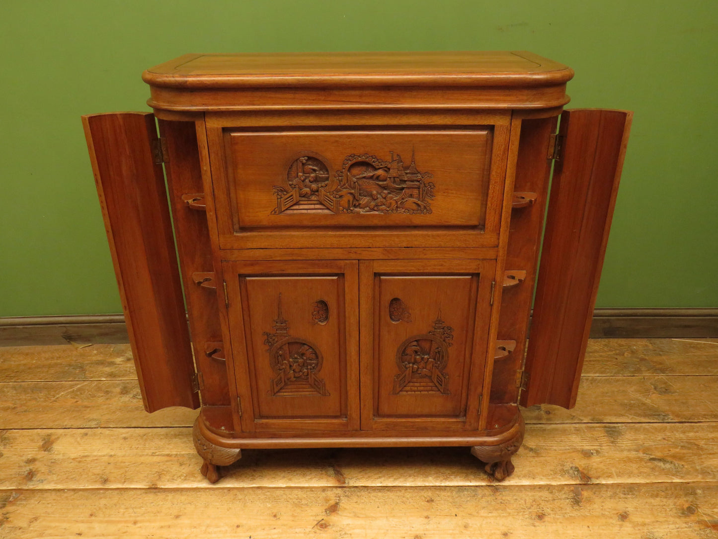 Oriental Hardwood Cocktail Cabinet with Bow Front & Carvings