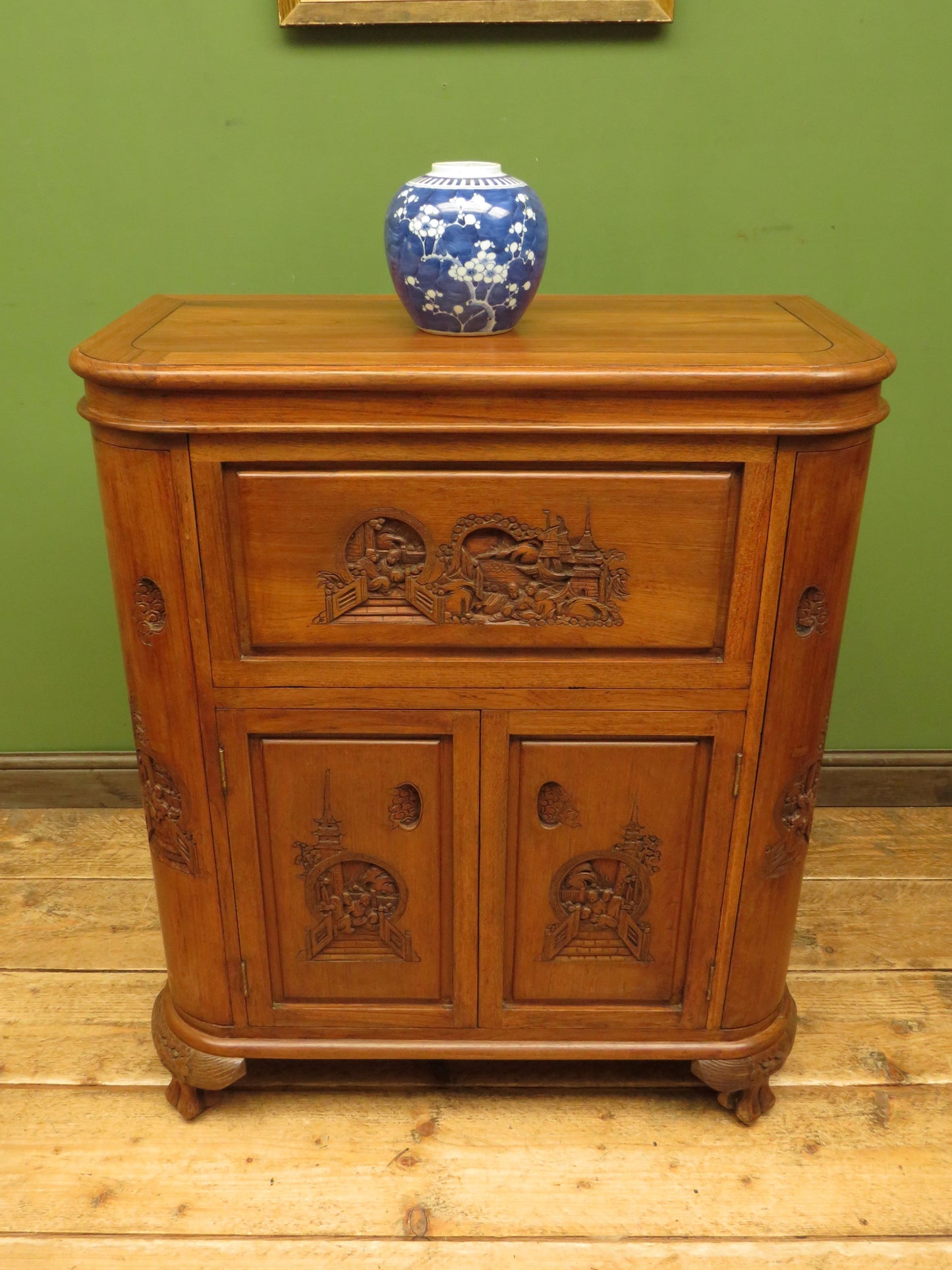 Oriental Hardwood Cocktail Cabinet with Bow Front & Carvings