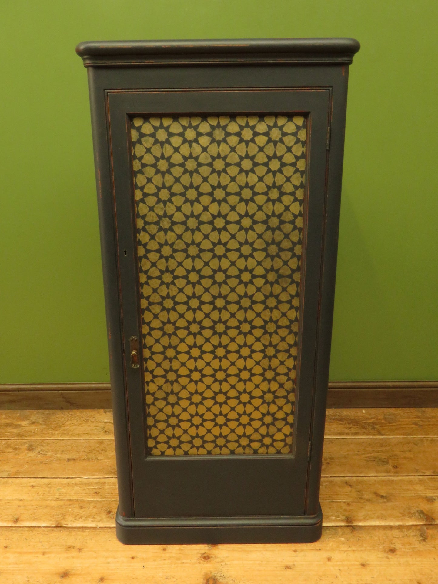 Narrow Black Cupboard with Geometric patterned door