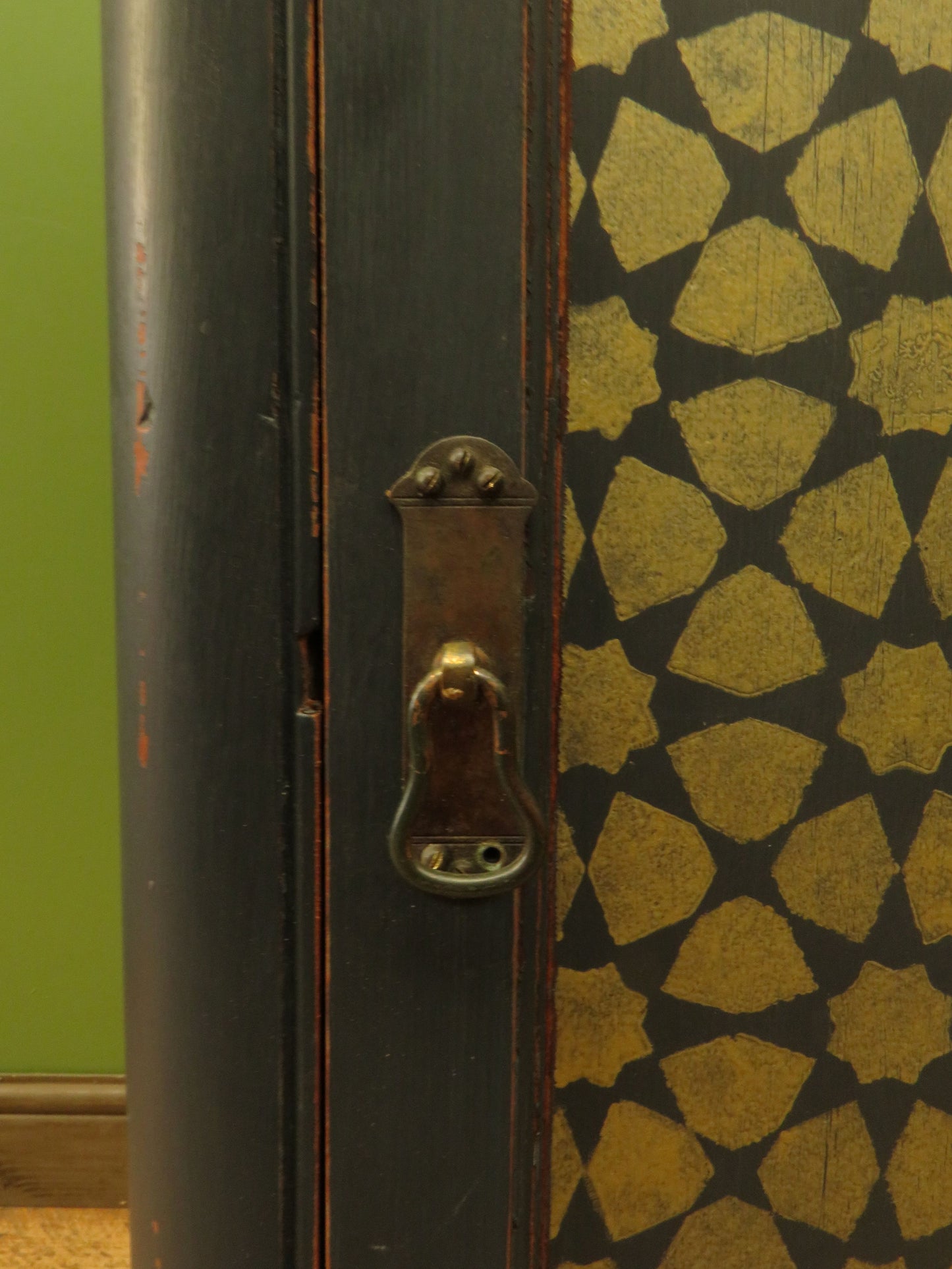 Narrow Black Cupboard with Geometric patterned door