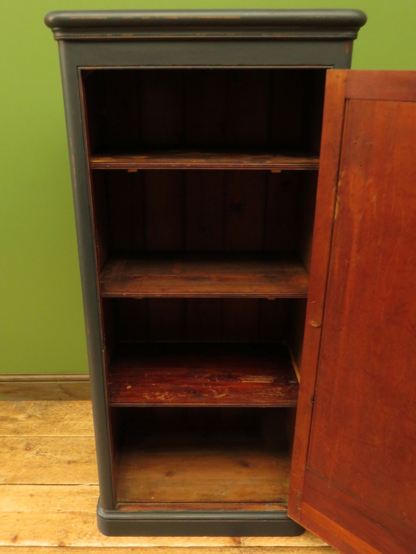 Narrow Black Cupboard with Geometric patterned door