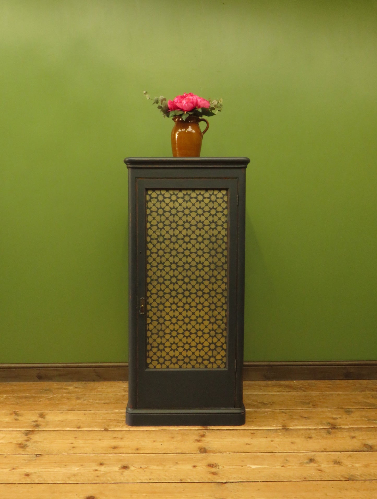 Narrow Black Cupboard with Geometric patterned door
