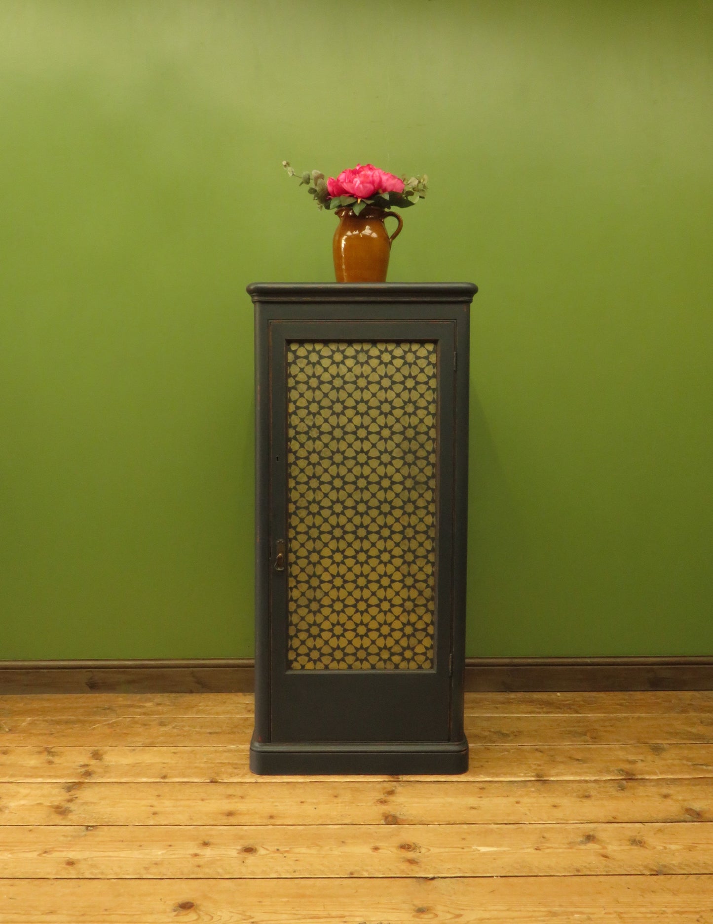 Narrow Black Cupboard with Geometric patterned door