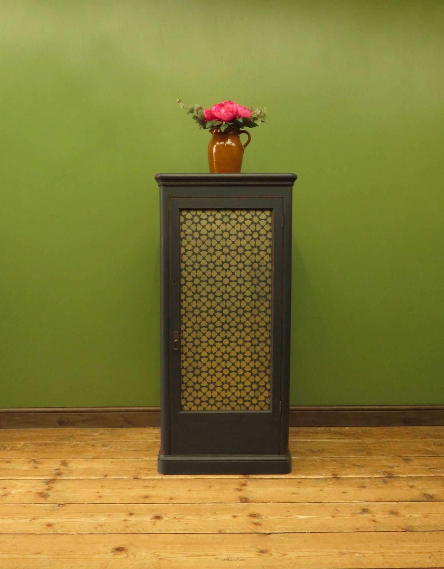 Narrow Black Cupboard with Geometric patterned door