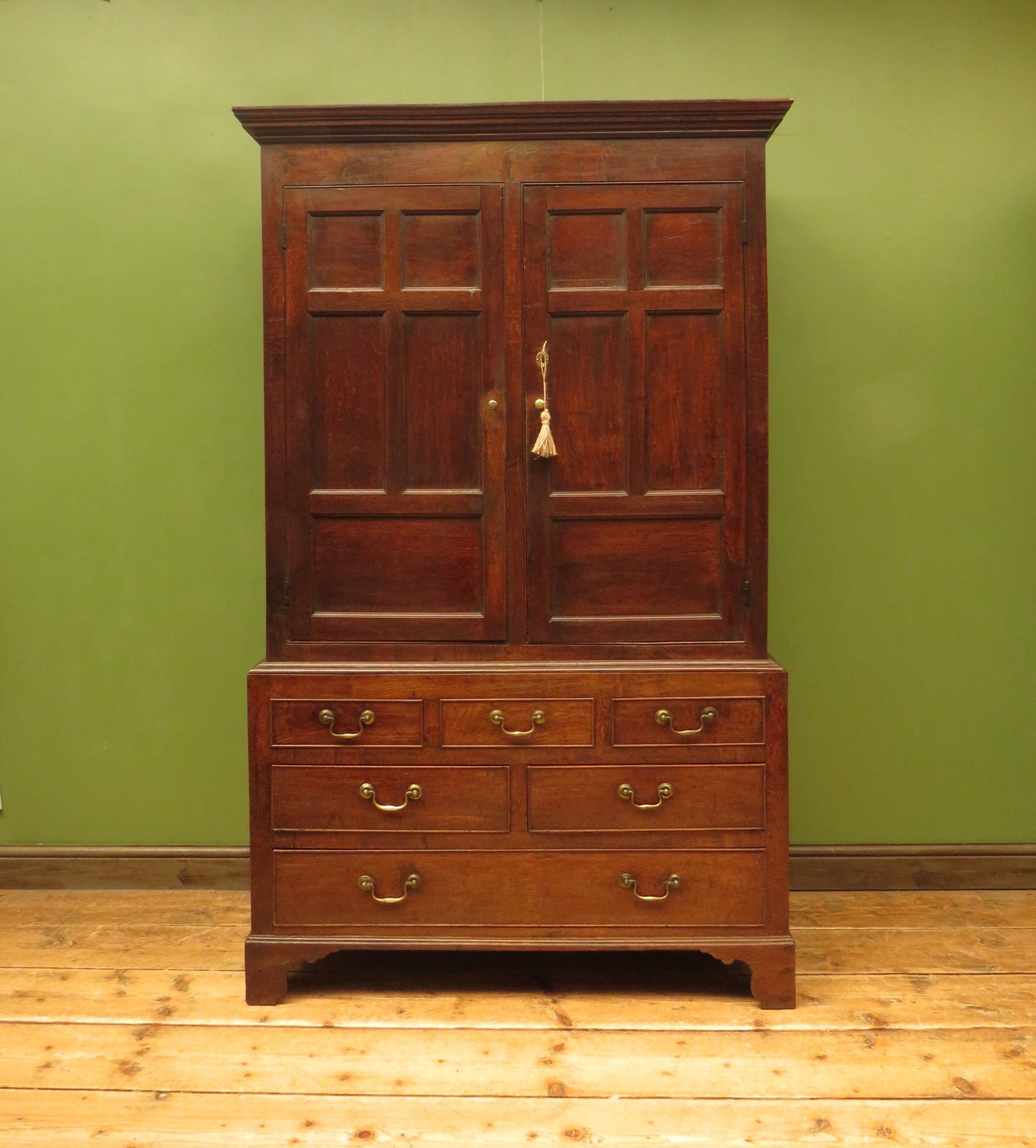 Antique two part Welsh oak linen press with richly aged finish