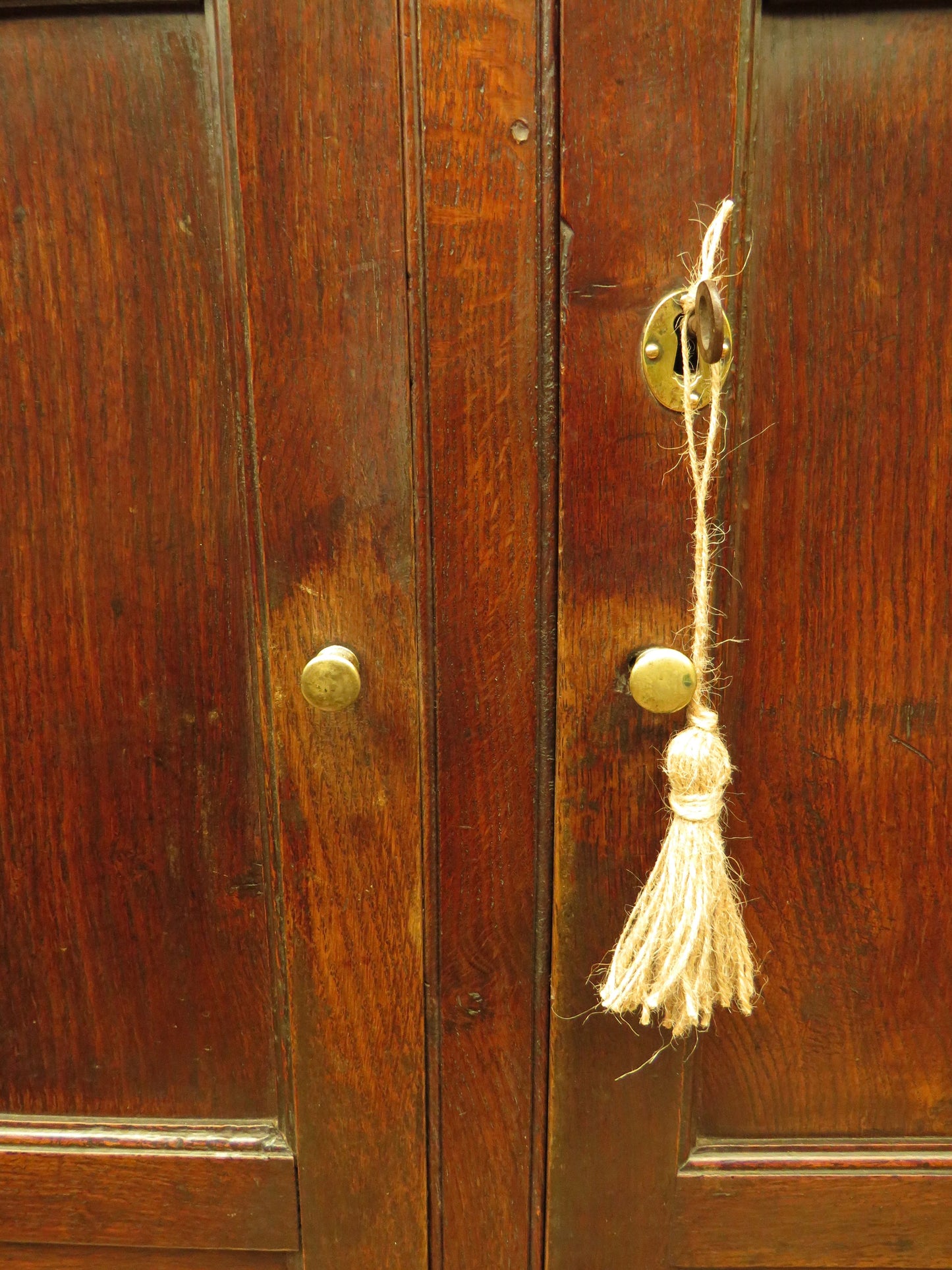 Antique two part Welsh oak linen press with richly aged finish