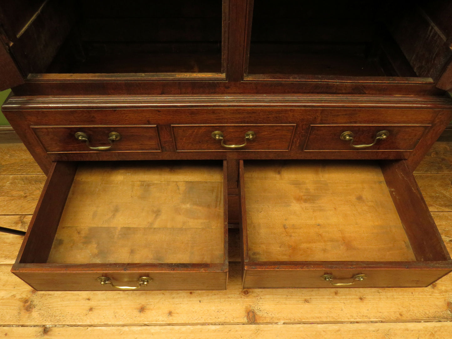 Antique two part Welsh oak linen press with richly aged finish