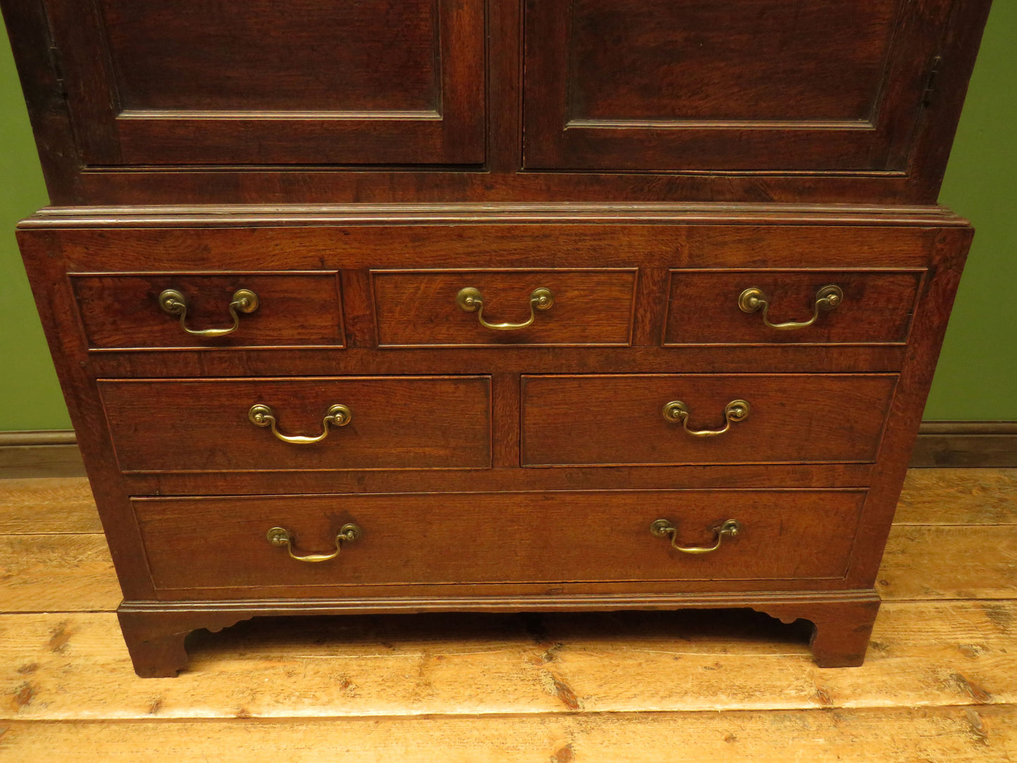 Antique two part Welsh oak linen press with richly aged finish