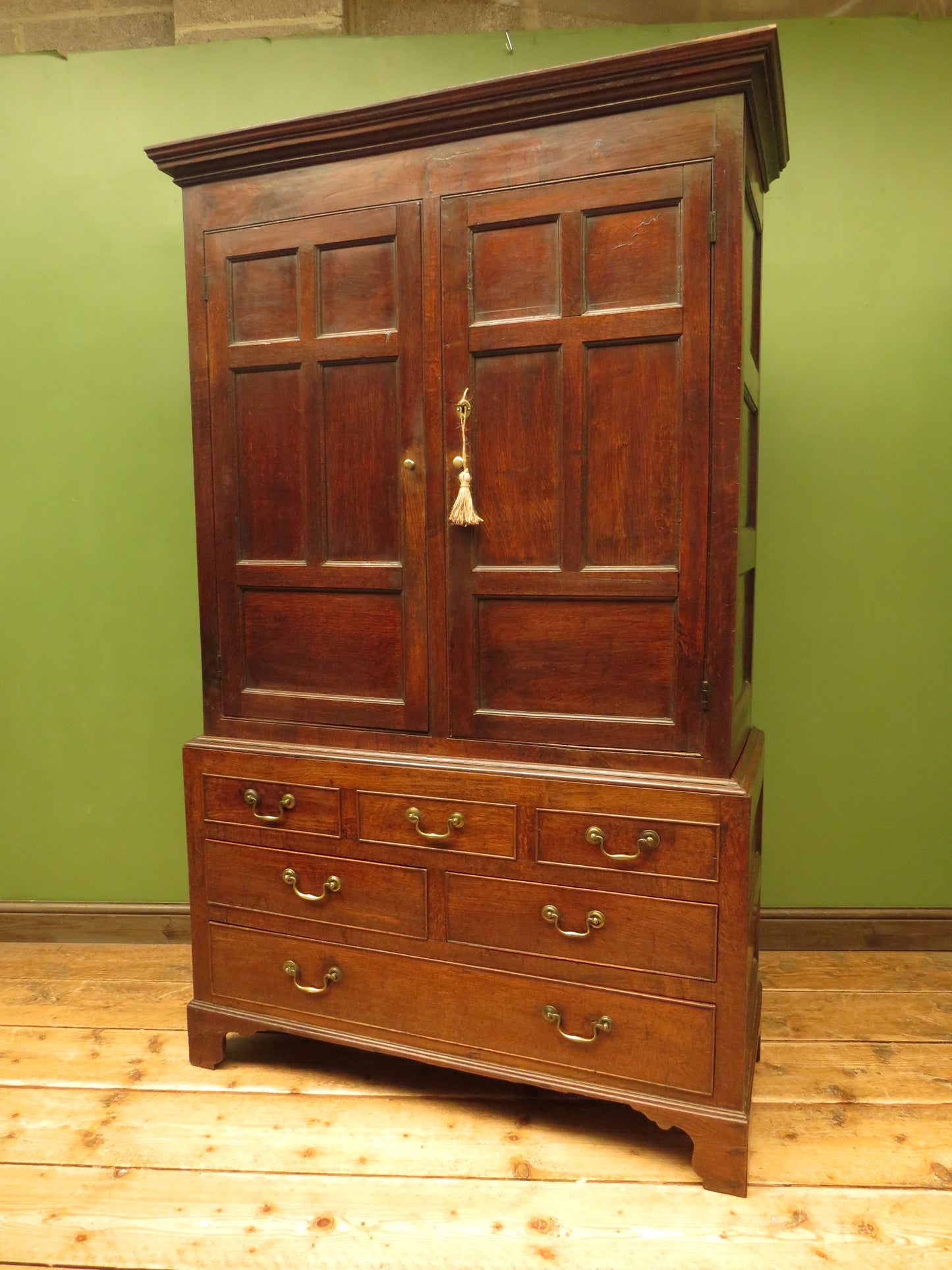 Antique two part Welsh oak linen press with richly aged finish