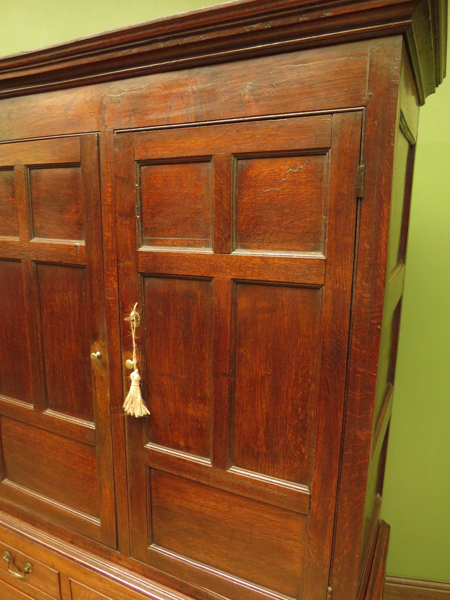 Antique two part Welsh oak linen press with richly aged finish