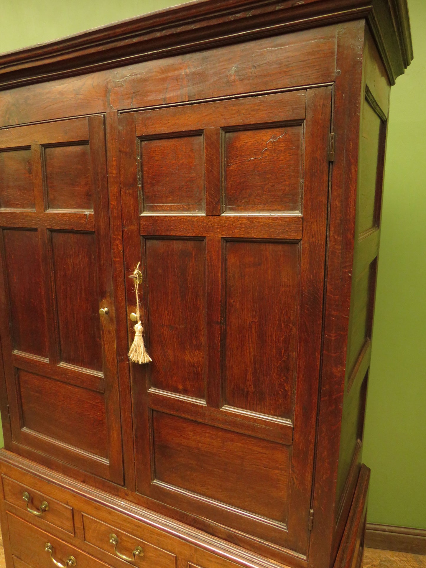 Antique two part Welsh oak linen press with richly aged finish