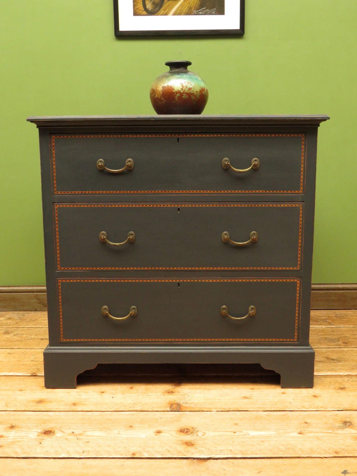 Black Painted Chest of Drawers with Intricate Inlaid Detailing