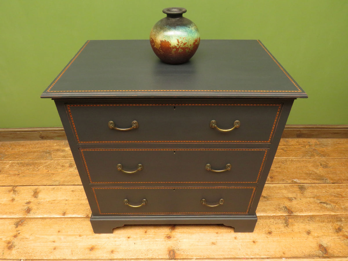 Black Painted Chest of Drawers with Intricate Inlaid Detailing