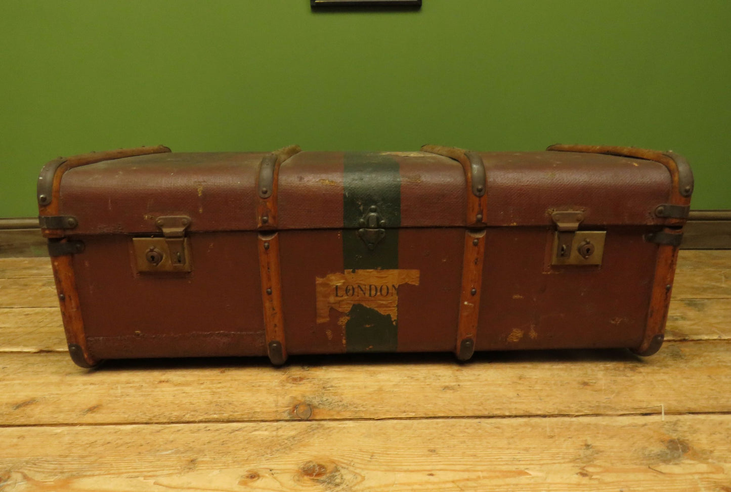Well travelled antique Steamer Trunk with luggage labels